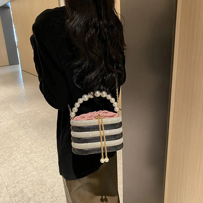 Women's retro style crossbody handbag with beaded pearl details on soft PU leather in a choice of colours.