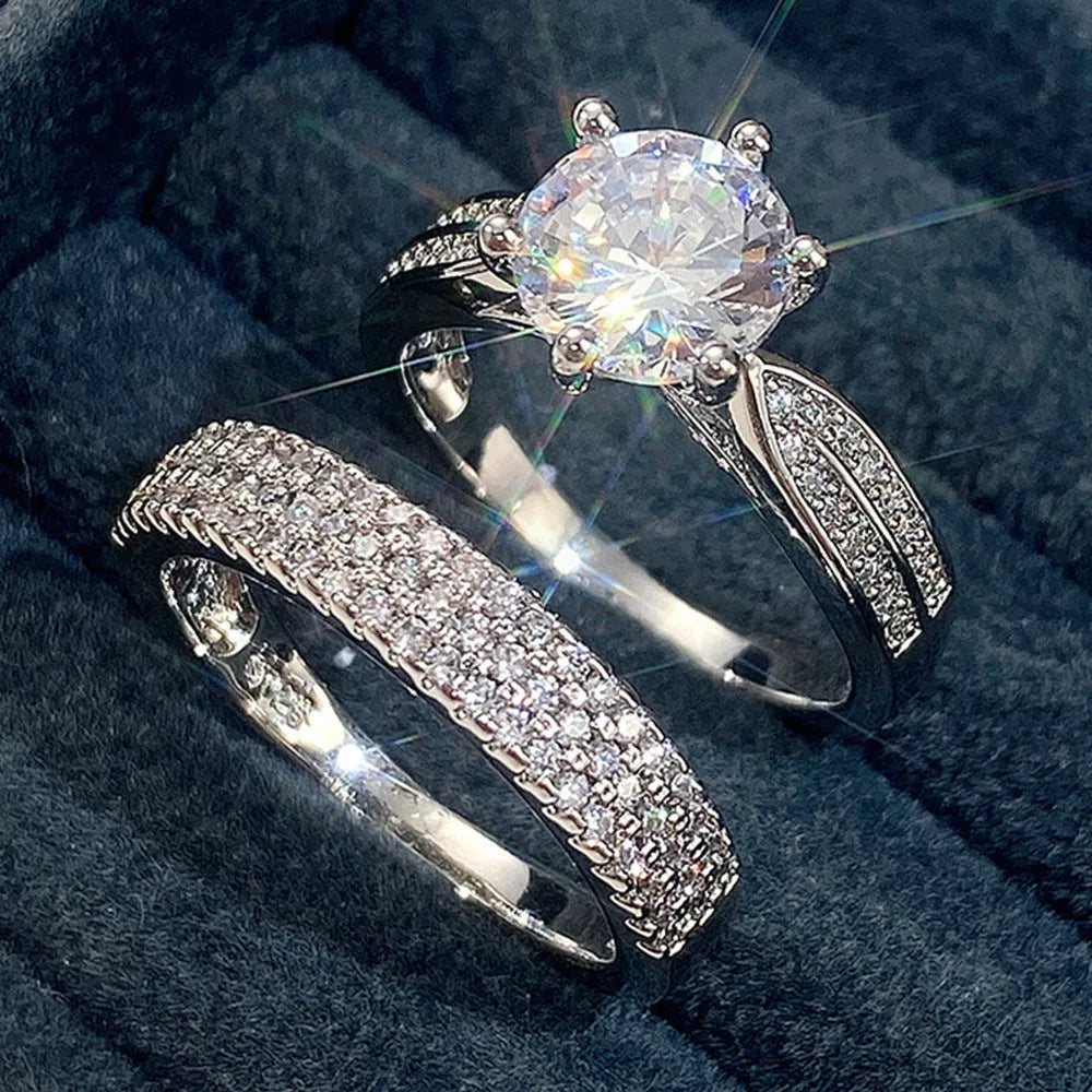 White gold colour geometric wedding combined ring bracelet with round details on a hand.