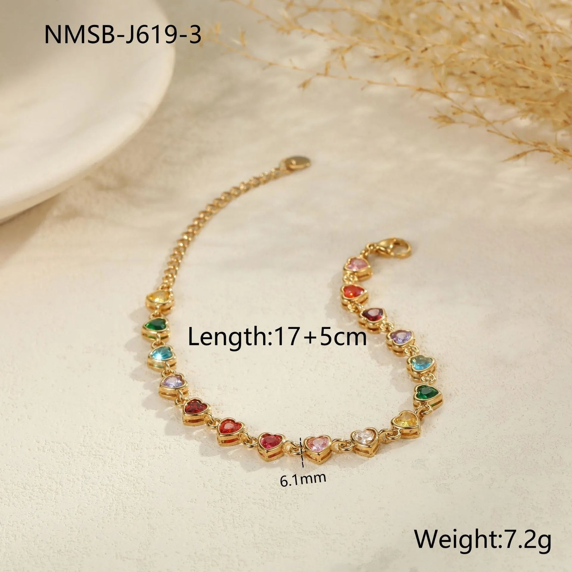 Gold and silver electroplated stainless steel bracelet with square, heart, and round geometric designs