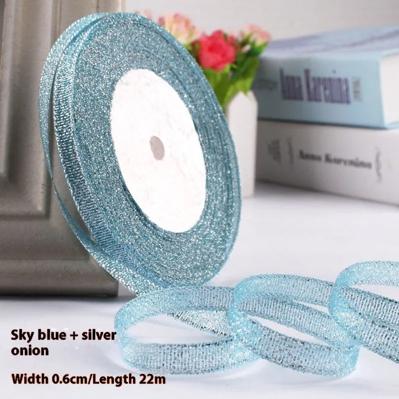 Roll of polyester gift ribbon showing 0.6cm width and multiple colour options including metallic finishes