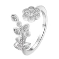 Women's open copper ring with diamond-treated floral and leaf design in gold colour.