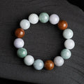 Women's Myanmar jade bracelet showing three-colour pattern on 13mm round beads.