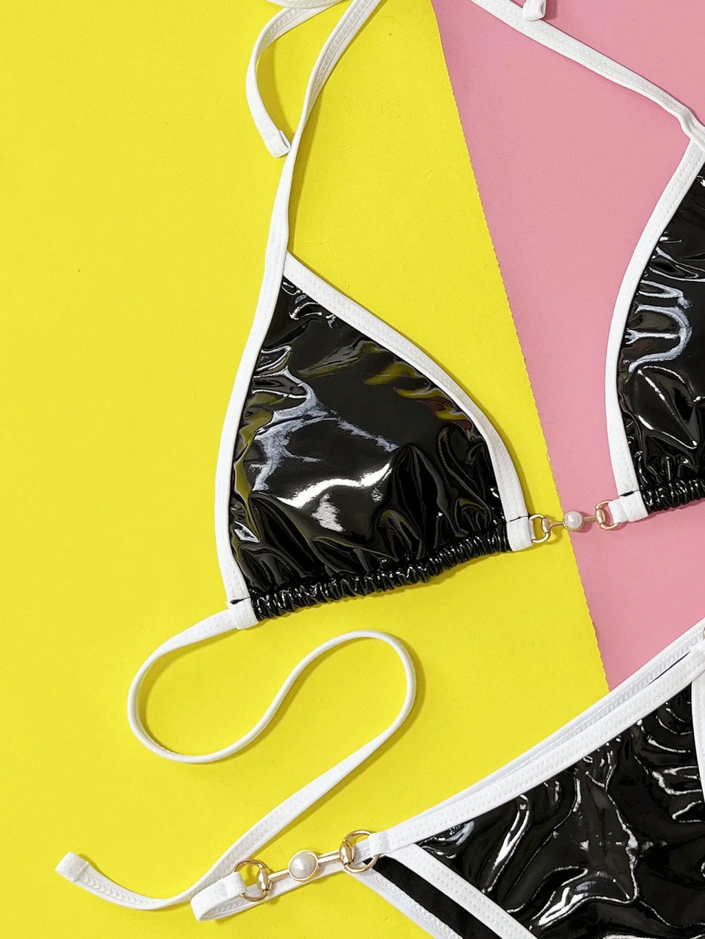 Women's black split bikini swimsuit set with brief style