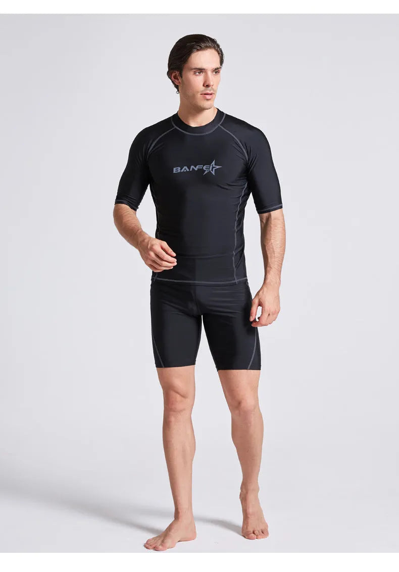 Men's quick-drying half sleeve swim suit with separate swim top and pants in navy blue.