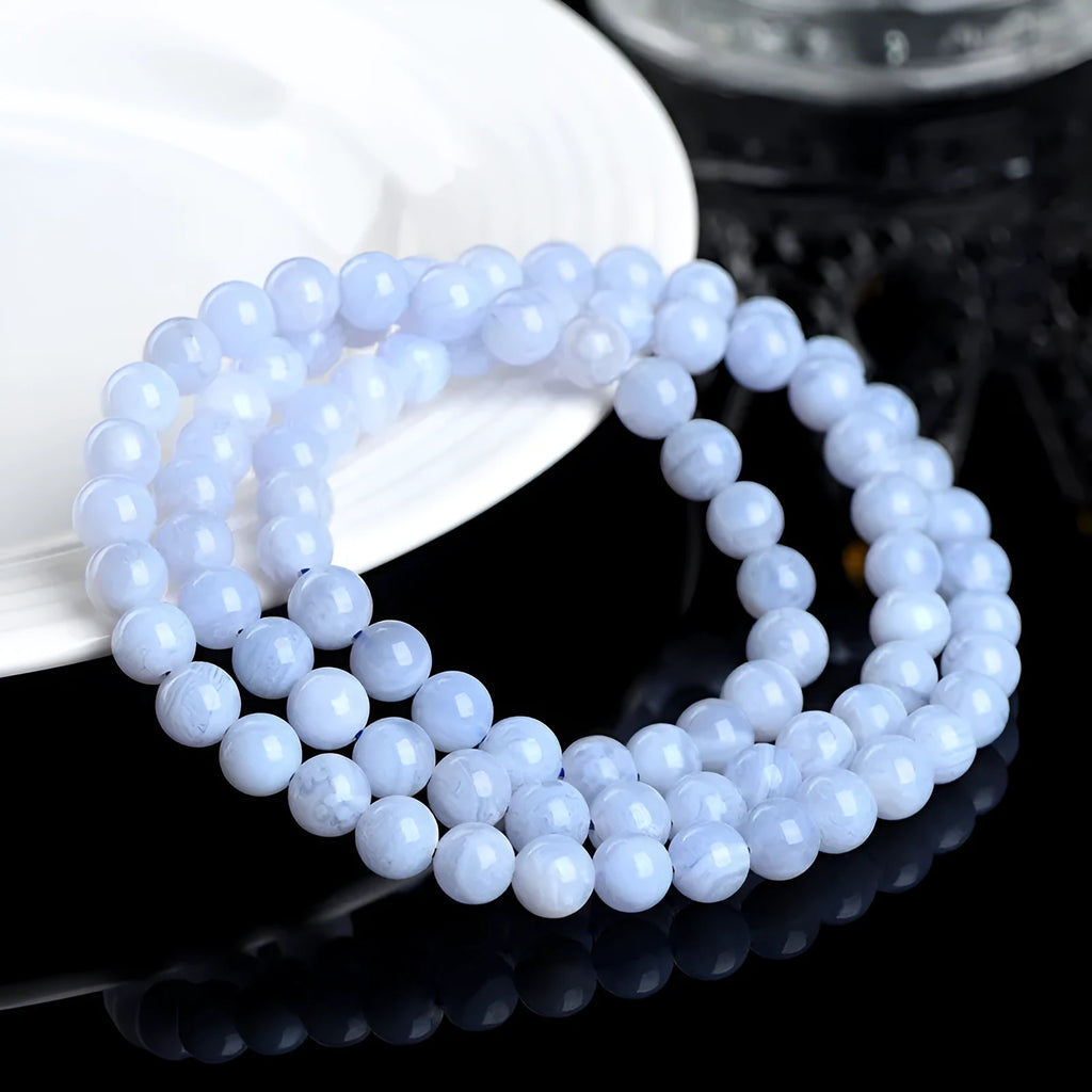 Blue agate bracelet with natural striped beads and Ruyi design elements