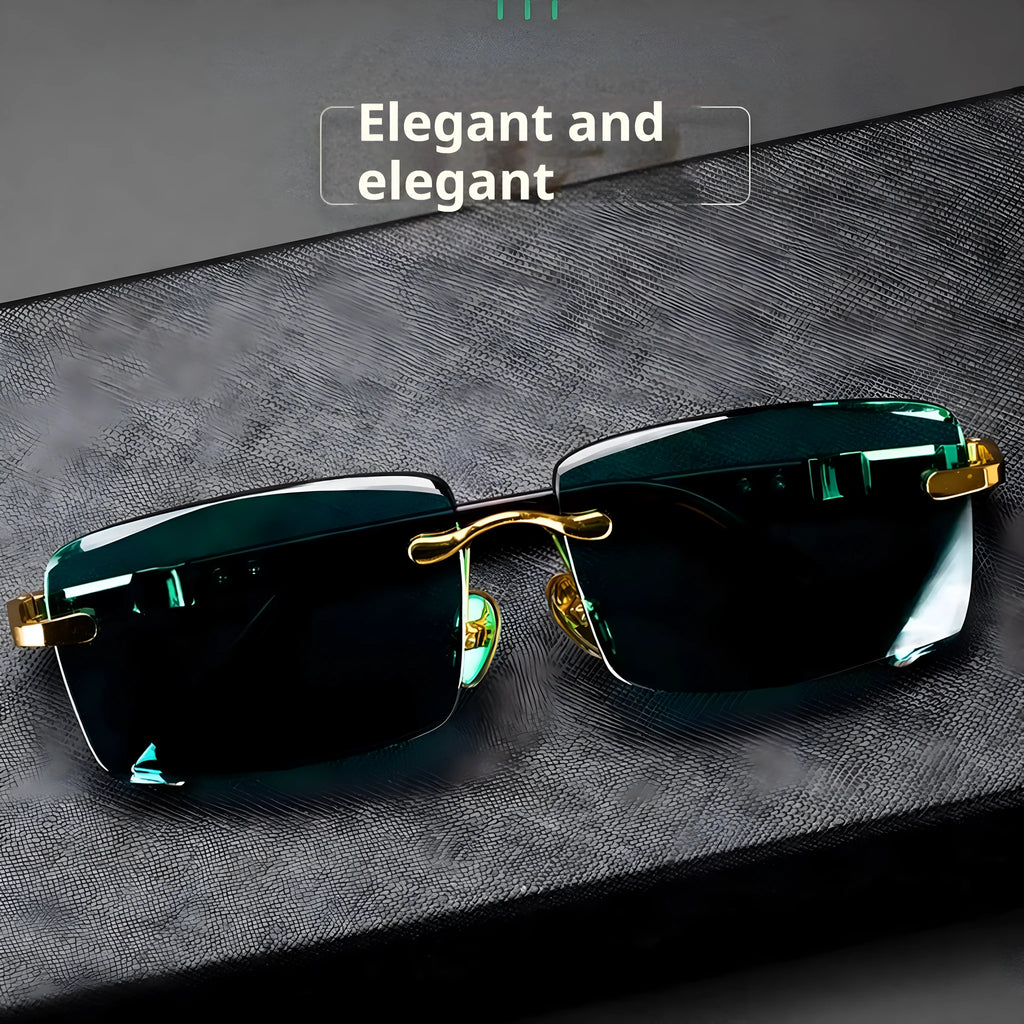Dark green frameless crystal sunglasses on a case with a lens cloth.