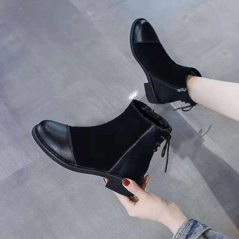 Black women's knee-high soft leather martin boots with side zip and bow detail.