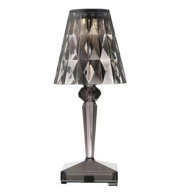 Rose gold portable touch night light with dimmable colours on a table.