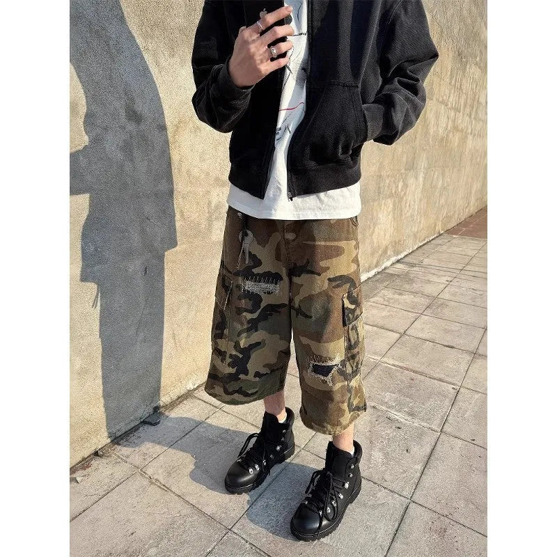 Men's camouflage pattern cropped jeans with distressed patches and straight leg cut