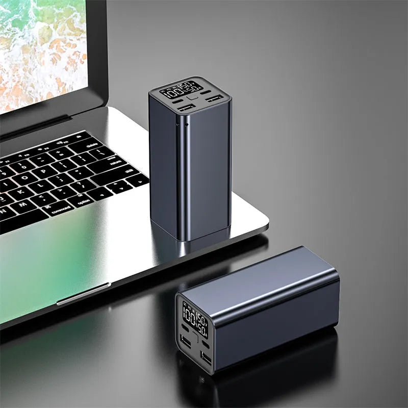 Black high power 65W metal laptop charging bank showing size and ports.