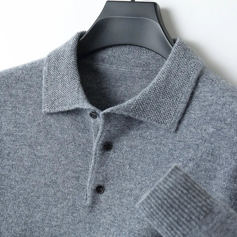 Men's grey wool blend pullover sweater with a polo collar and long sleeves laid flat