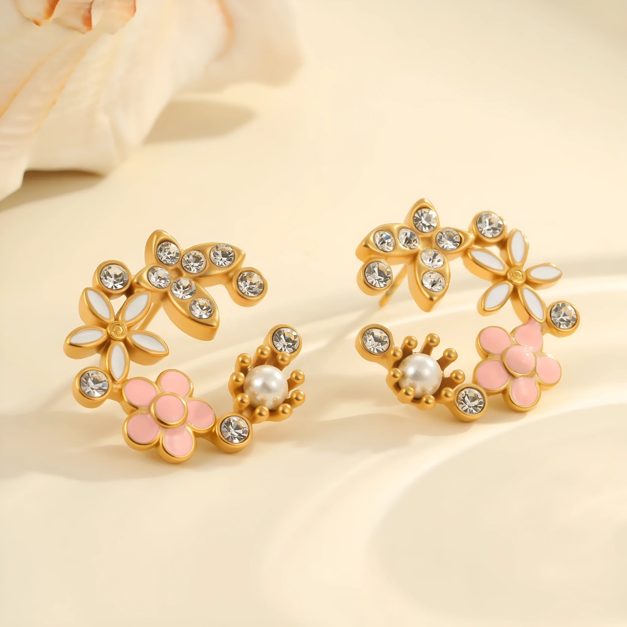 Gold flower stud earrings with petal design on stainless steel backing