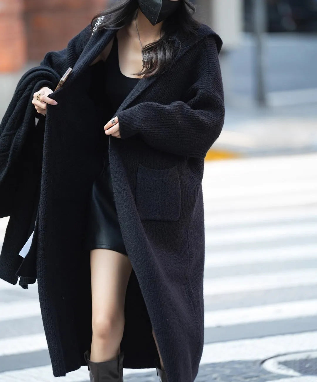 Long knitted hooded cardigan trench coat in wool blend cashmere fabric showing splicing sleeve details