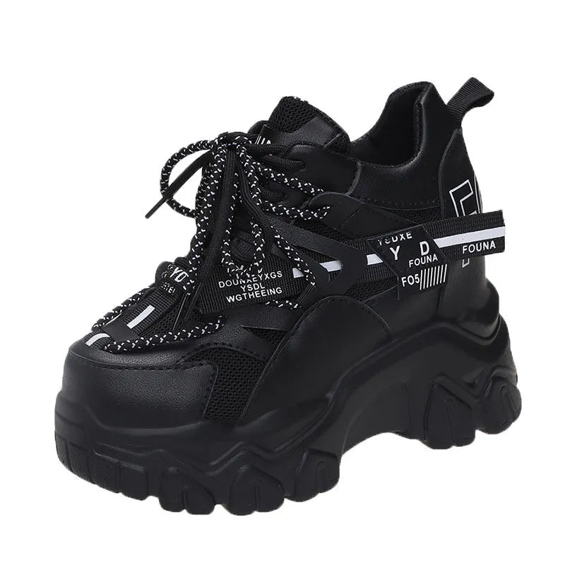 White and black women's low-top mesh platform sports shoes with cross strap and round toe.