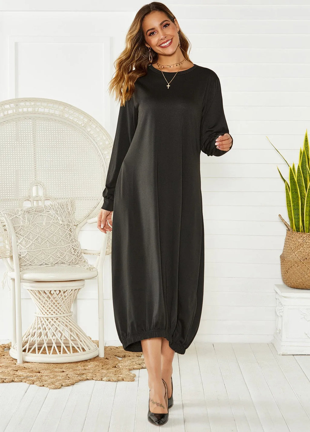 Black loose lantern dress with lace-up crew neck and long sleeves on mannequin