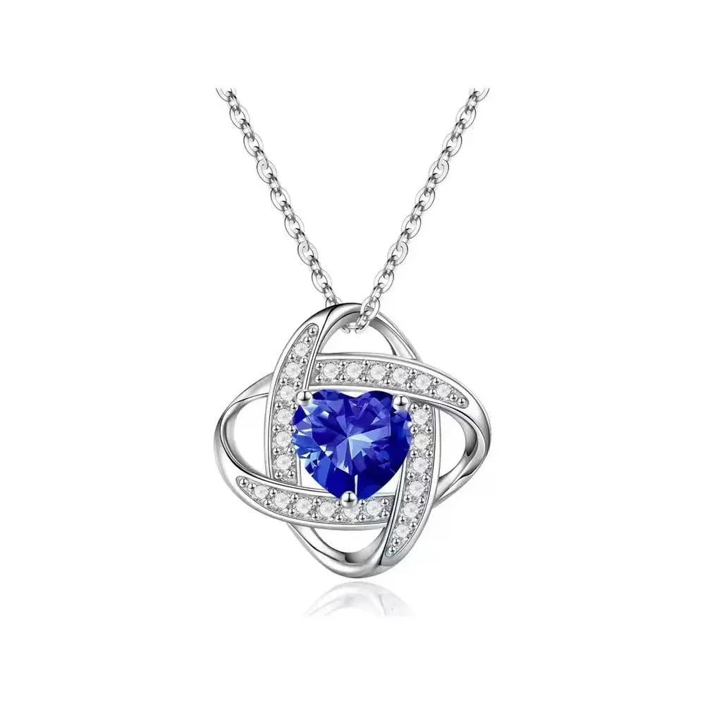 Copper heart necklace with electroplated platinum finish showing multiple colour variations