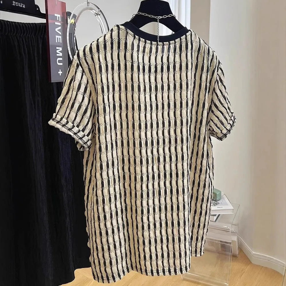 Black striped men's loose fit casual short sleeve pullover shirt on a hanger.
