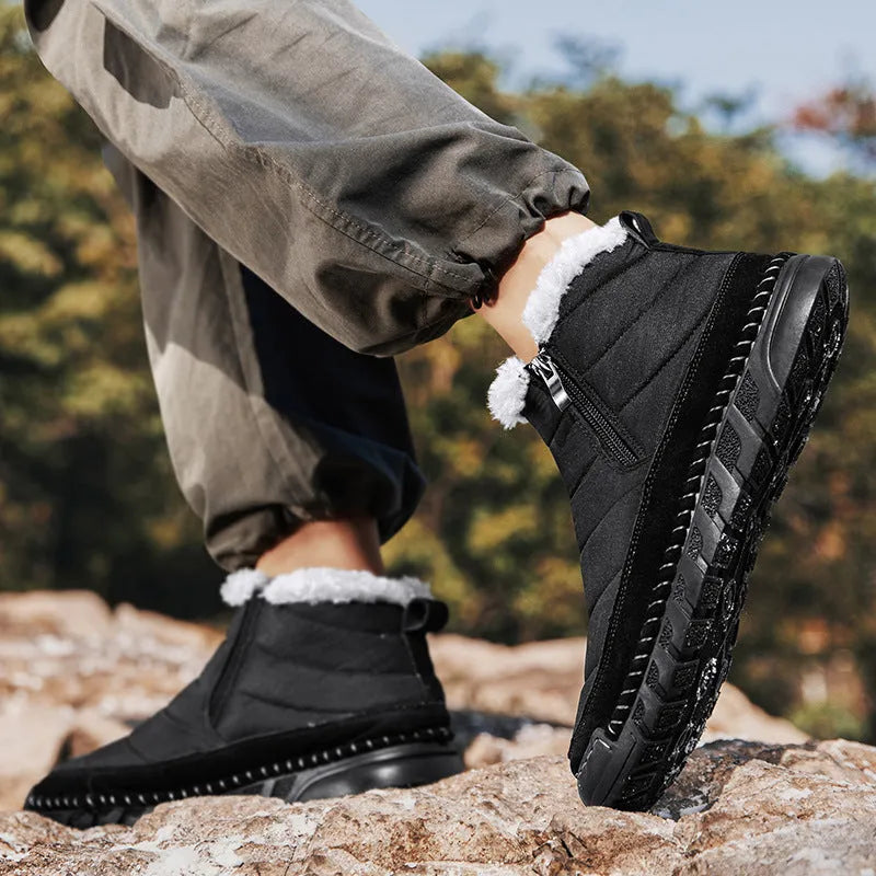 Men's plus size snow boots in black with round toe, flat heel and rubber sole