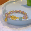 Women's floral glazed bracelet with coloured glass beads and zodiac animal charm on electroplated metal.