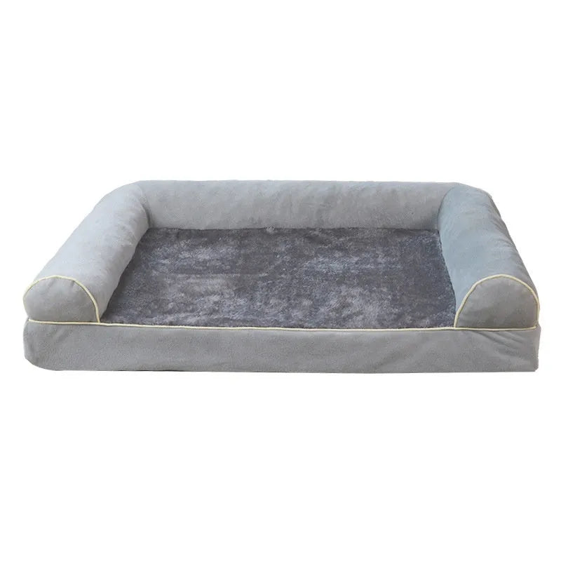 A square, cloth-covered sponge dog bed shown in blue, with a dog resting on it.