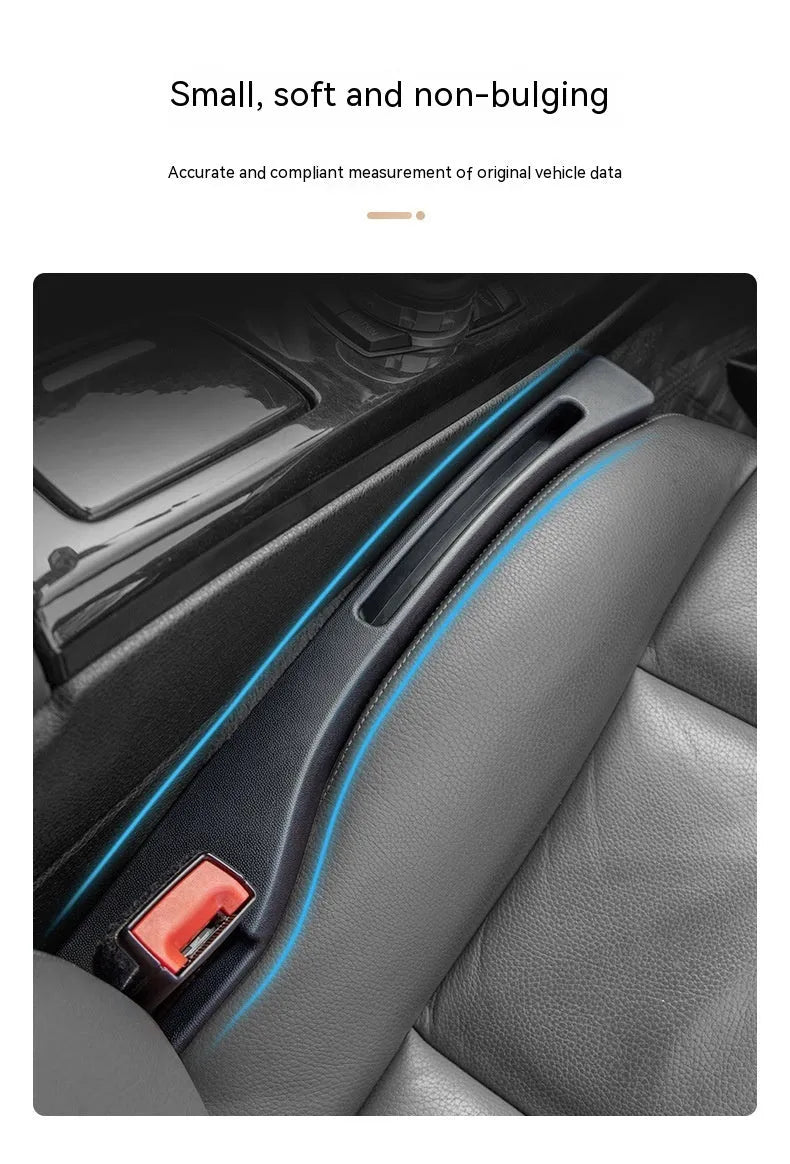 Black car gap storage box with handle positioned between car seats