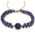 Handmade woven bracelet with geometric pattern in blue tigereye stone beads and pull closure.