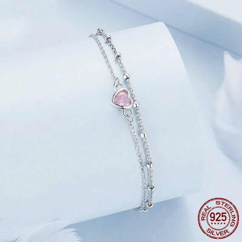 Sweet girlish style 925 sterling silver bracelet with a small heart-shaped charm on an adjustable chain.