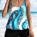Blue tie-dyed women's swimsuit set with floral pattern, showing bikini top and brief-style shorts.