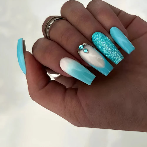 Long ballet shape artificial nails in solid smart blue diamond colour with nail glue bottle.
