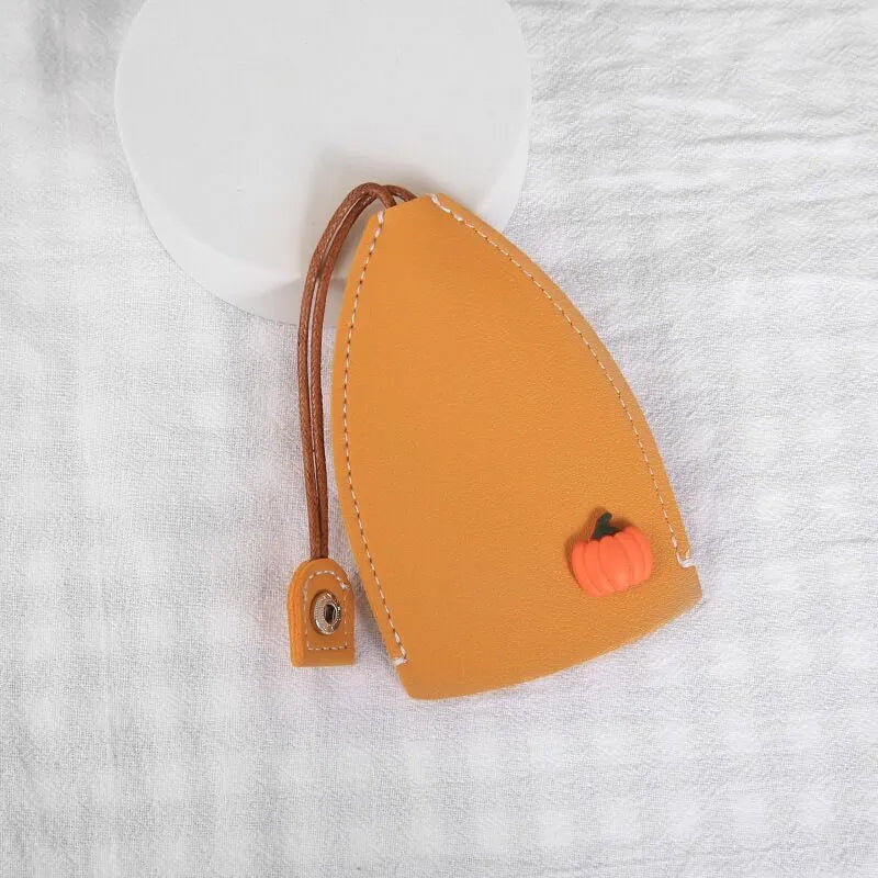 Cartoon pull-out car key case in PU leather with colourful designs measuring 14 x 7.5 cm