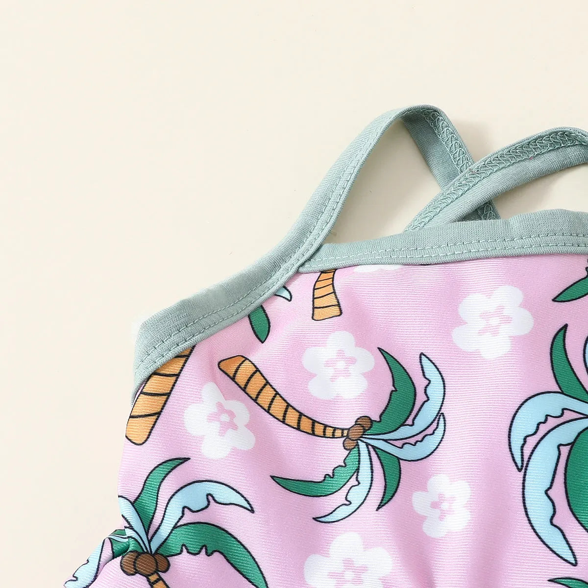 White children's two-piece swimsuit set with a top and matching shorts on a hanger.