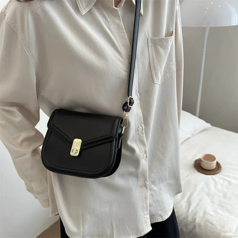 Soft PU shoulder messenger bag in horizontal square clamshell shape with niche texture.