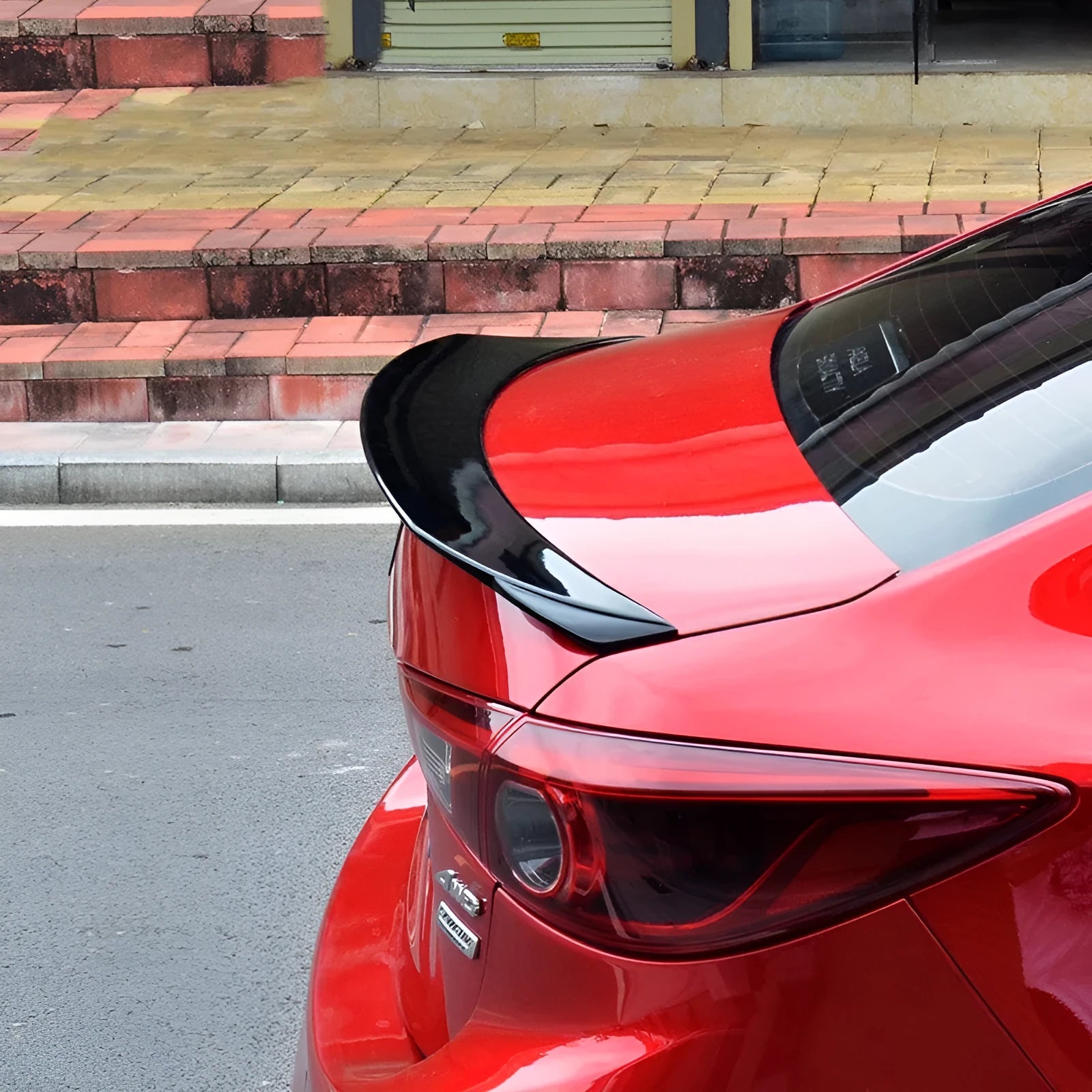 Mazda 3 Axela Exela tail trim spoiler accessory for 2014-2021 models in bright black and carbon grain options