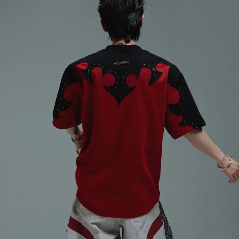 Men's grey cotton T-shirt with burnt flower stitching and rhinestone decoration showing loose fit drop shoulder design