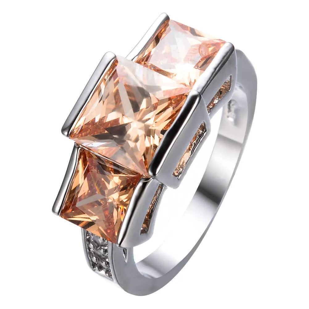 Women's geometric rainbow metal ring in electroplated copper showing colour options.