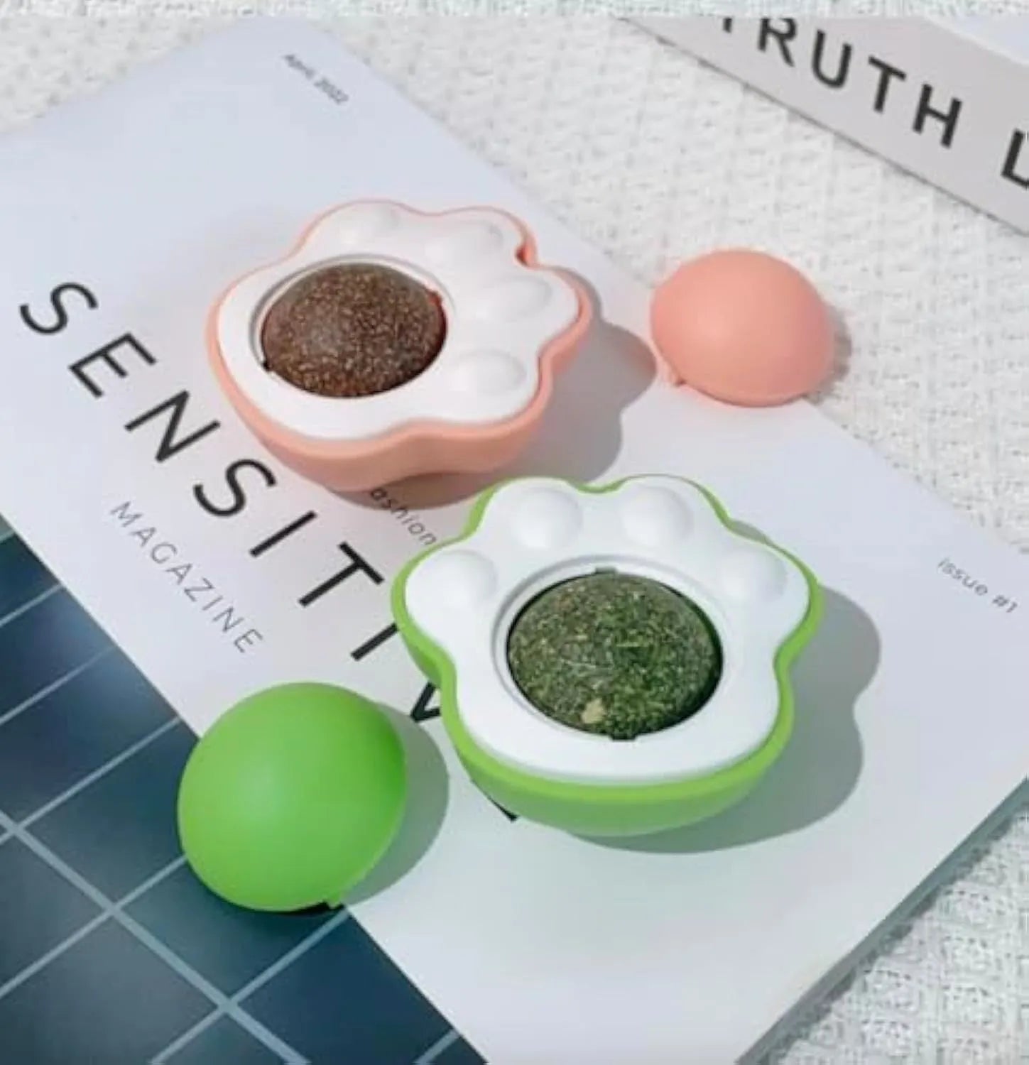 Four colourful catnip balls with textured surfaces for dental cleaning and interactive play