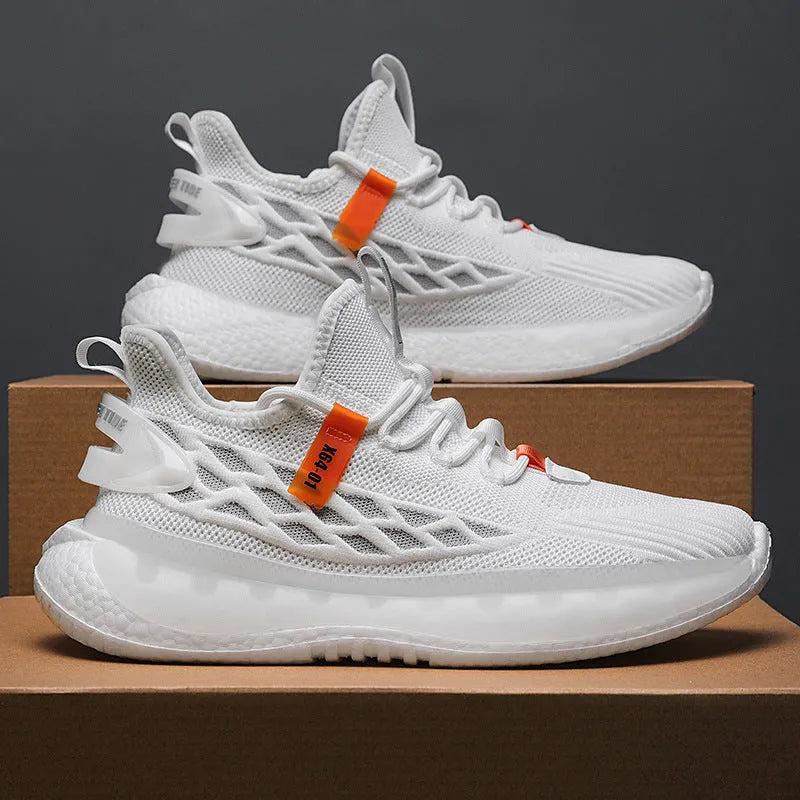 Men's low-top white mesh sneakers with a rubber sole and round toe on a plain background.