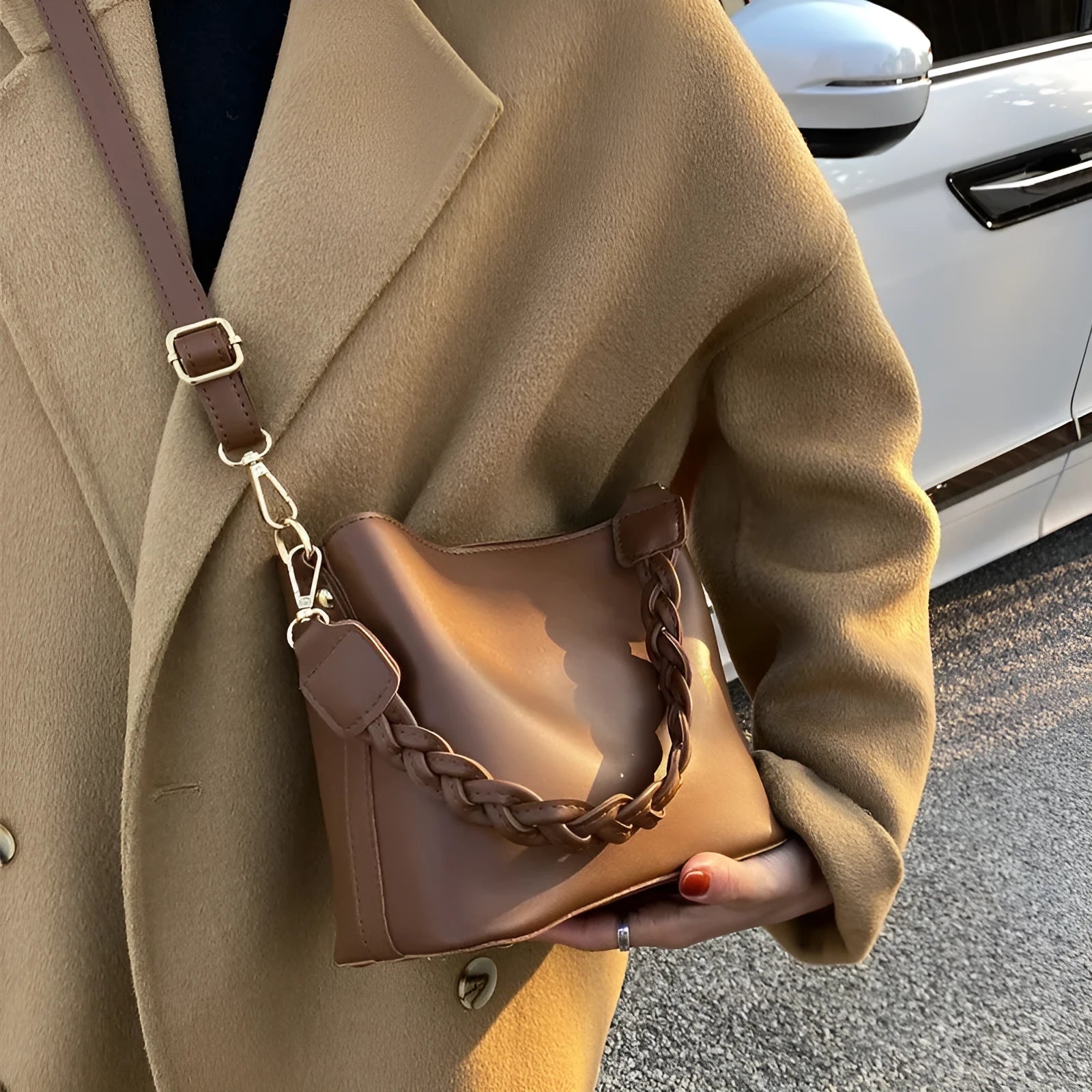 Retro khaki crossbody bucket bag with woven PU detailing and adjustable strap.