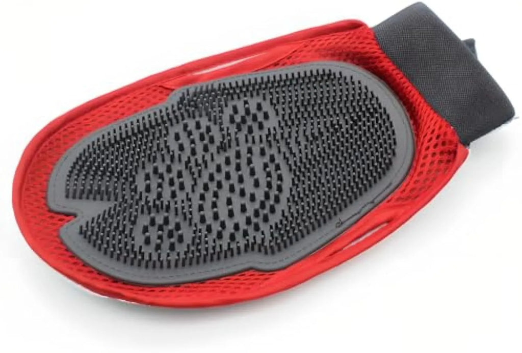 Red pet bathing and grooming glove combining a brush and mitt, shown on a hand.