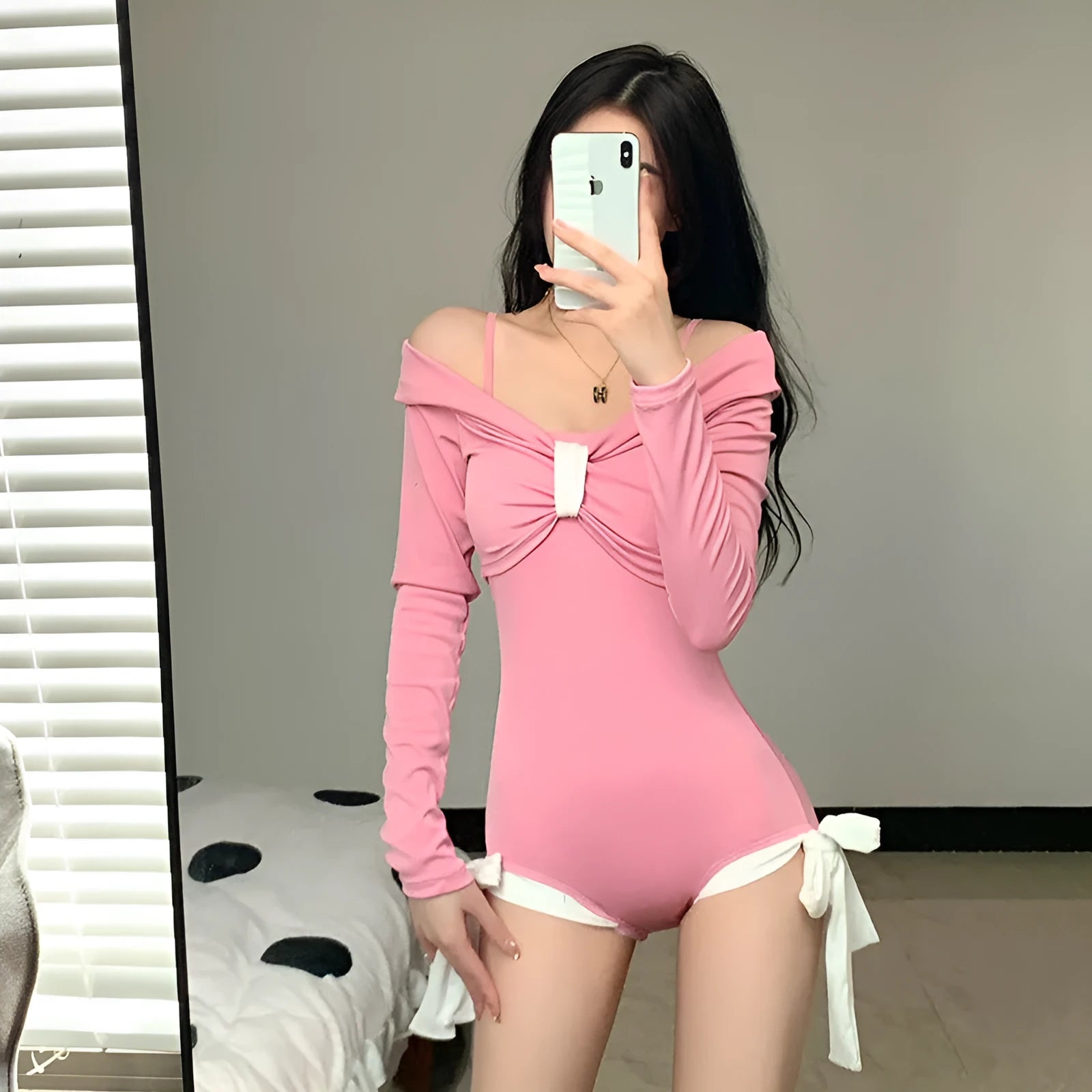 Women's long sleeve one-piece swimsuit in pink or black polyester