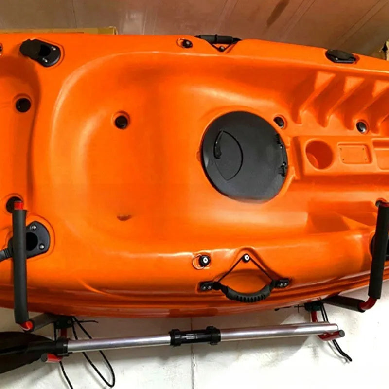 Carbon steel kayak and surfboard wall storage rack mounted on a garage wall.