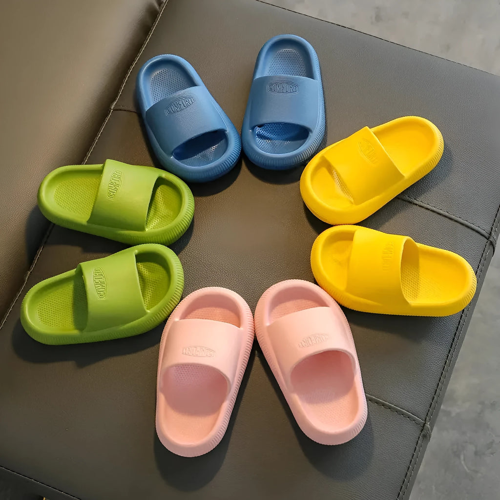 Children's non-slip EVA slippers in bright colours, showing the 1.5cm thick sole.