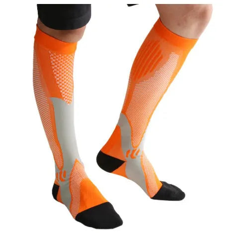 Athletic fit graduated compression socks for men and women in black, shown on a leg.