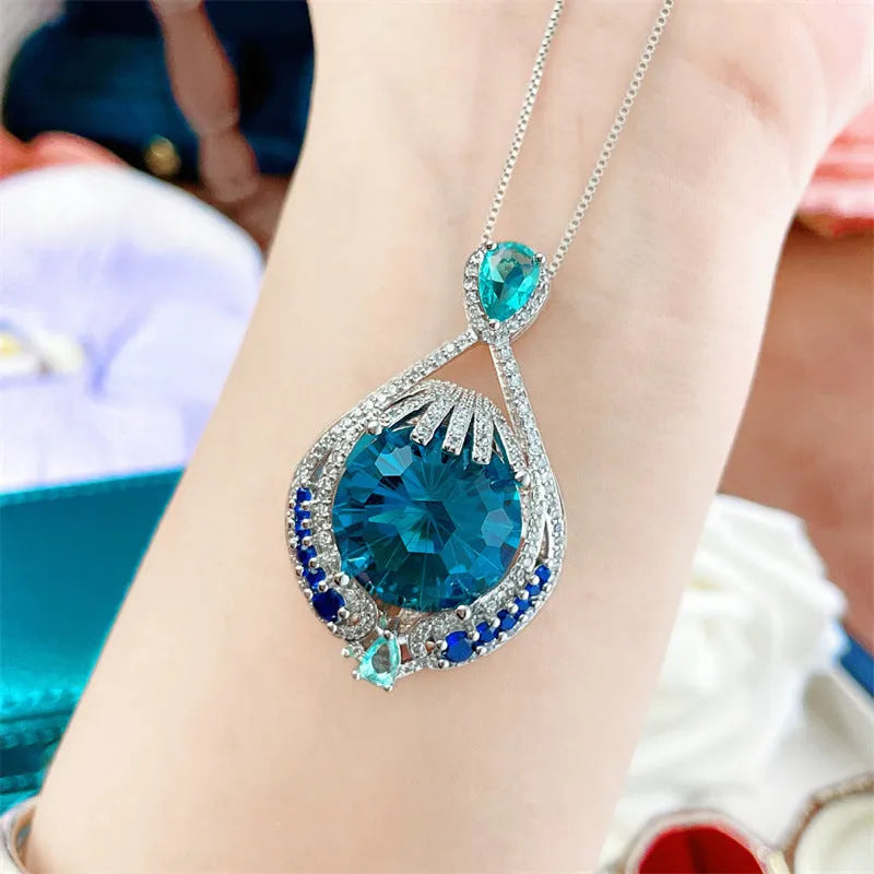 Women's blue crystal geometric pendant necklace with water wave chain and alloy construction