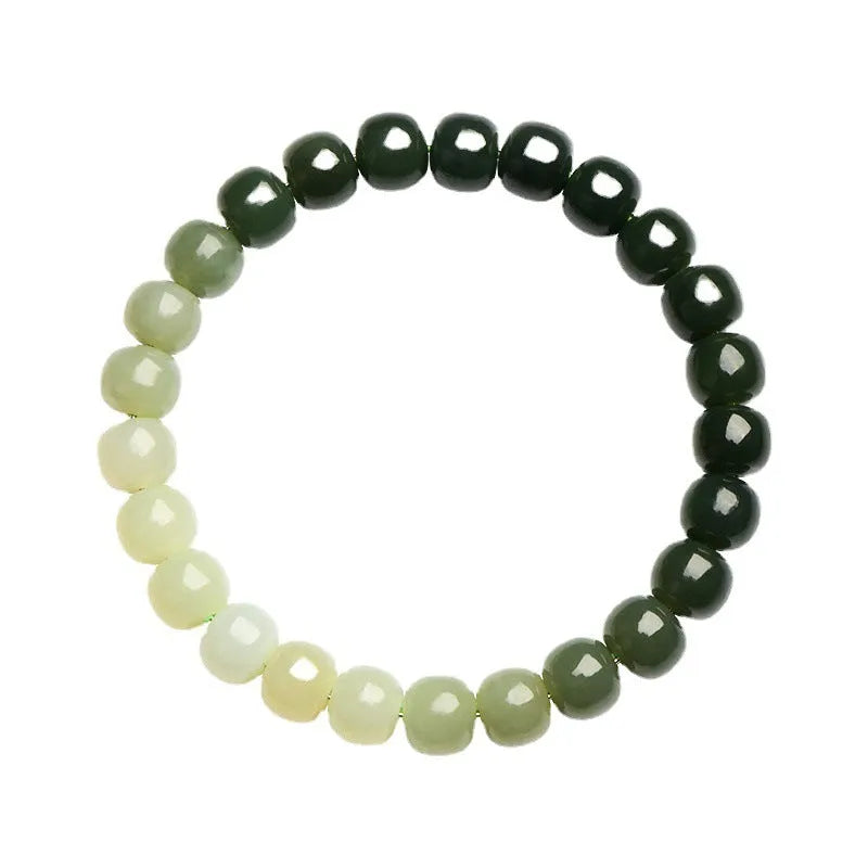 Natural Hetian Jade bracelet showing water gradient colour on wrist, with polished beads.