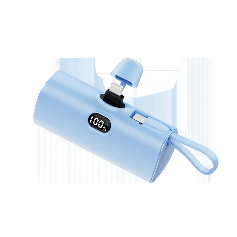Compact rectangular power bank with digital display, showing colour options: black, white, pink, blue, green.