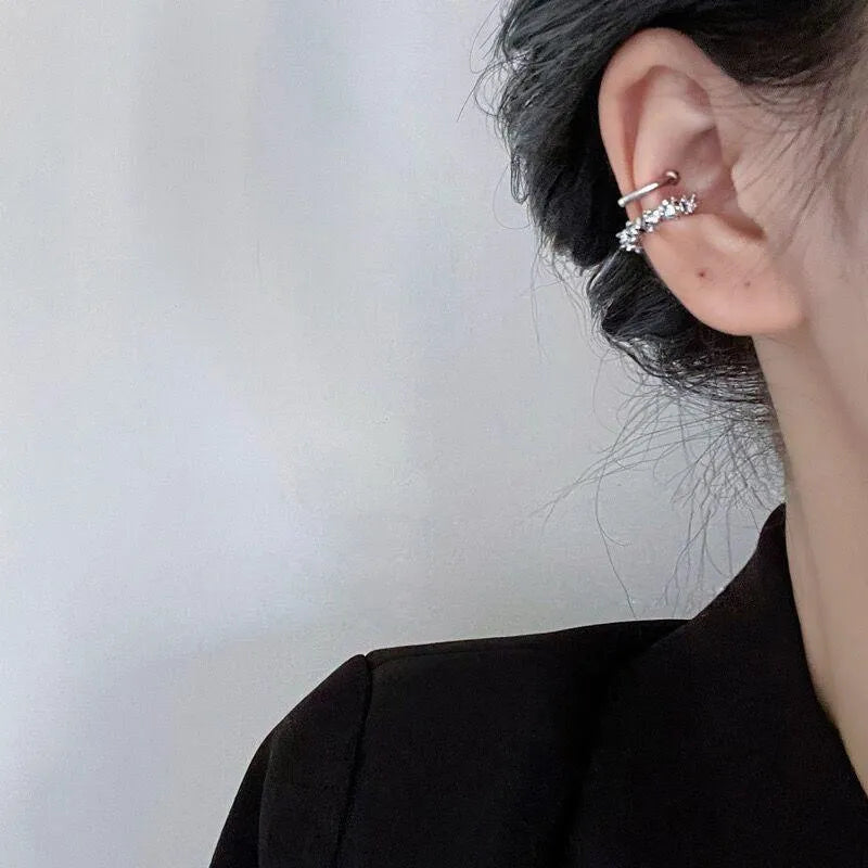 A pair of frosty-finish geometric alloy earrings with ear clip fastenings.