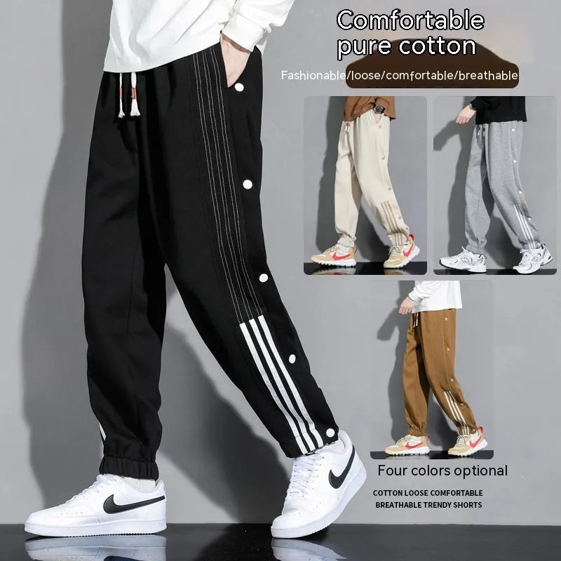 Men's loose fit cotton blend sports pants with high waist and ankle-tied cuffs in solid colours