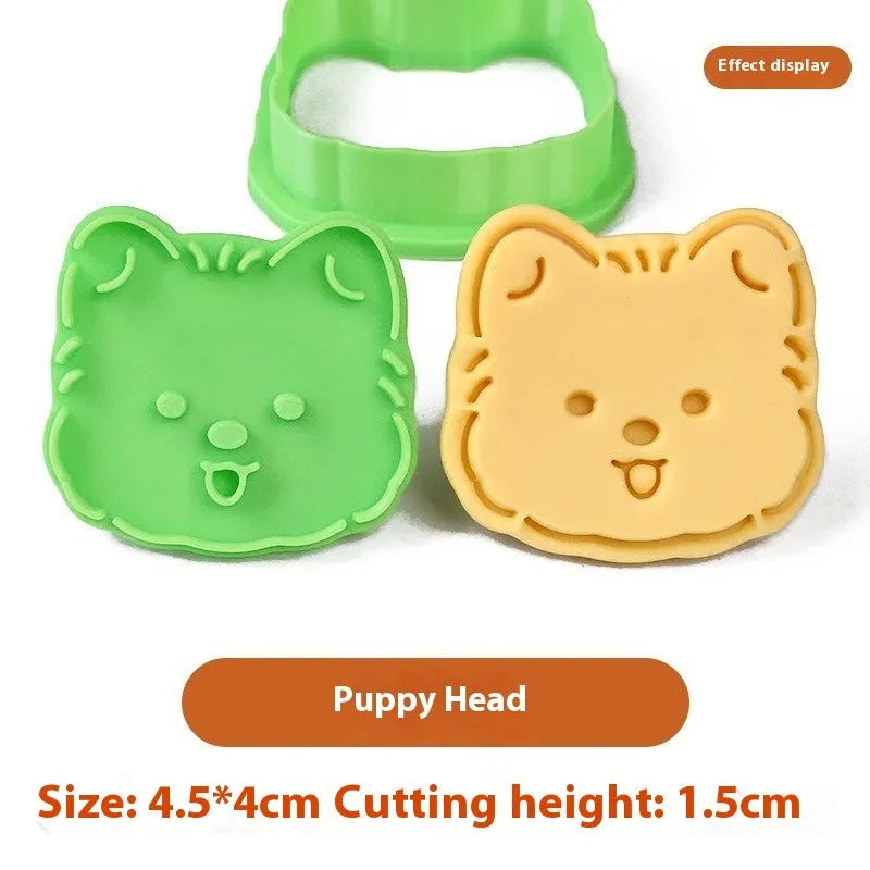 3D plastic biscuit mould with cartoon dog shapes including puppy head and birthday hat