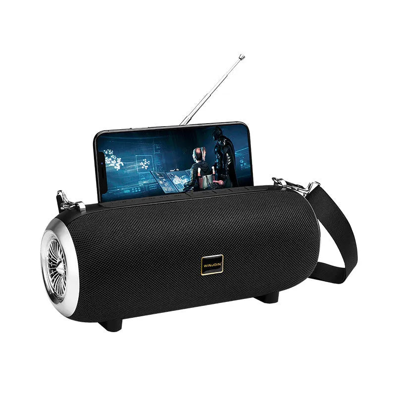 F666 mini square fabric portable Bluetooth speaker with shoulder strap and retractable FM antenna.